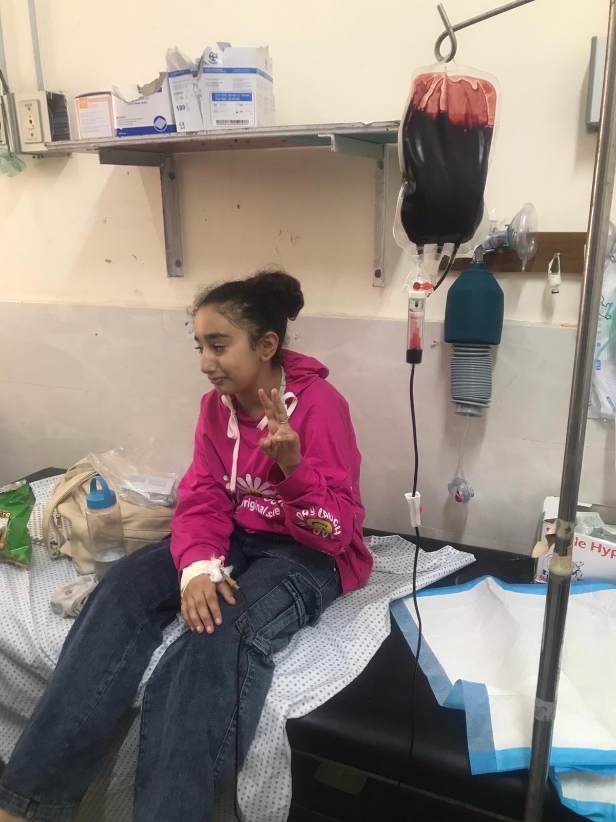 A child receiving treatment on a hospital ward.