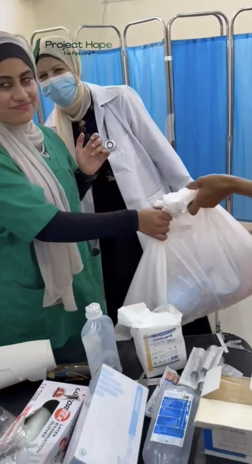 Handing over a delivery of medical supplies.