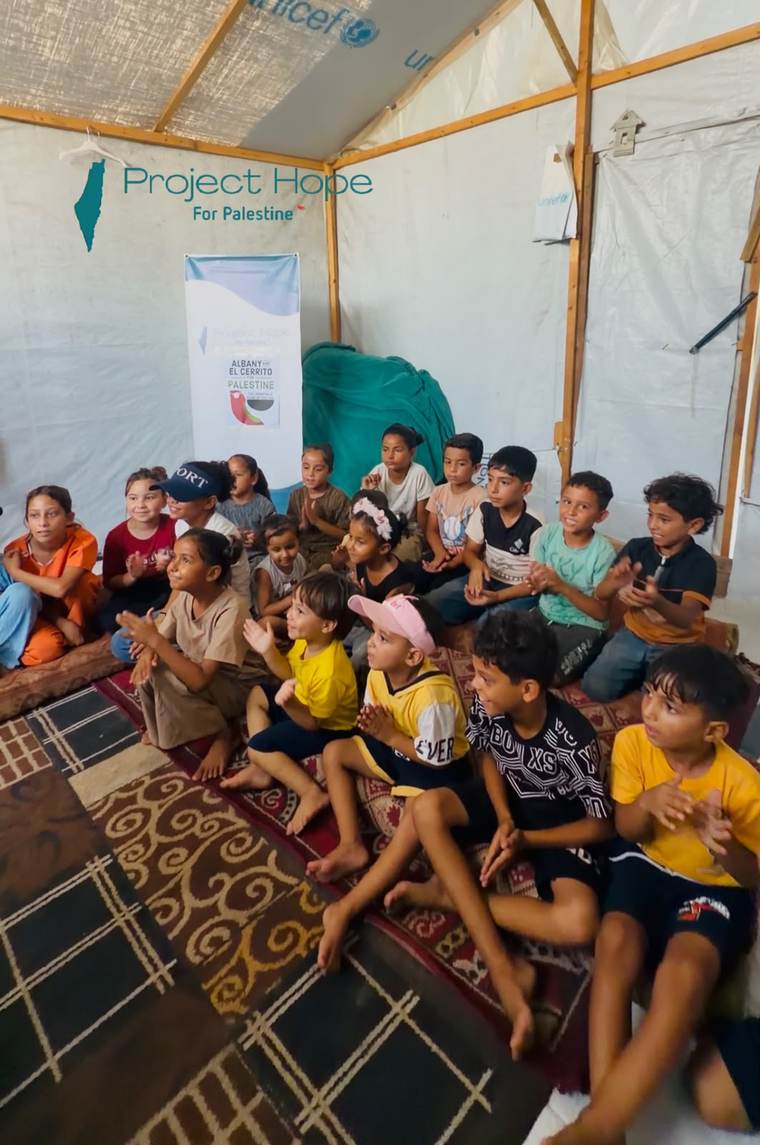 Children in a Project Hope learning tent in a displacement camp